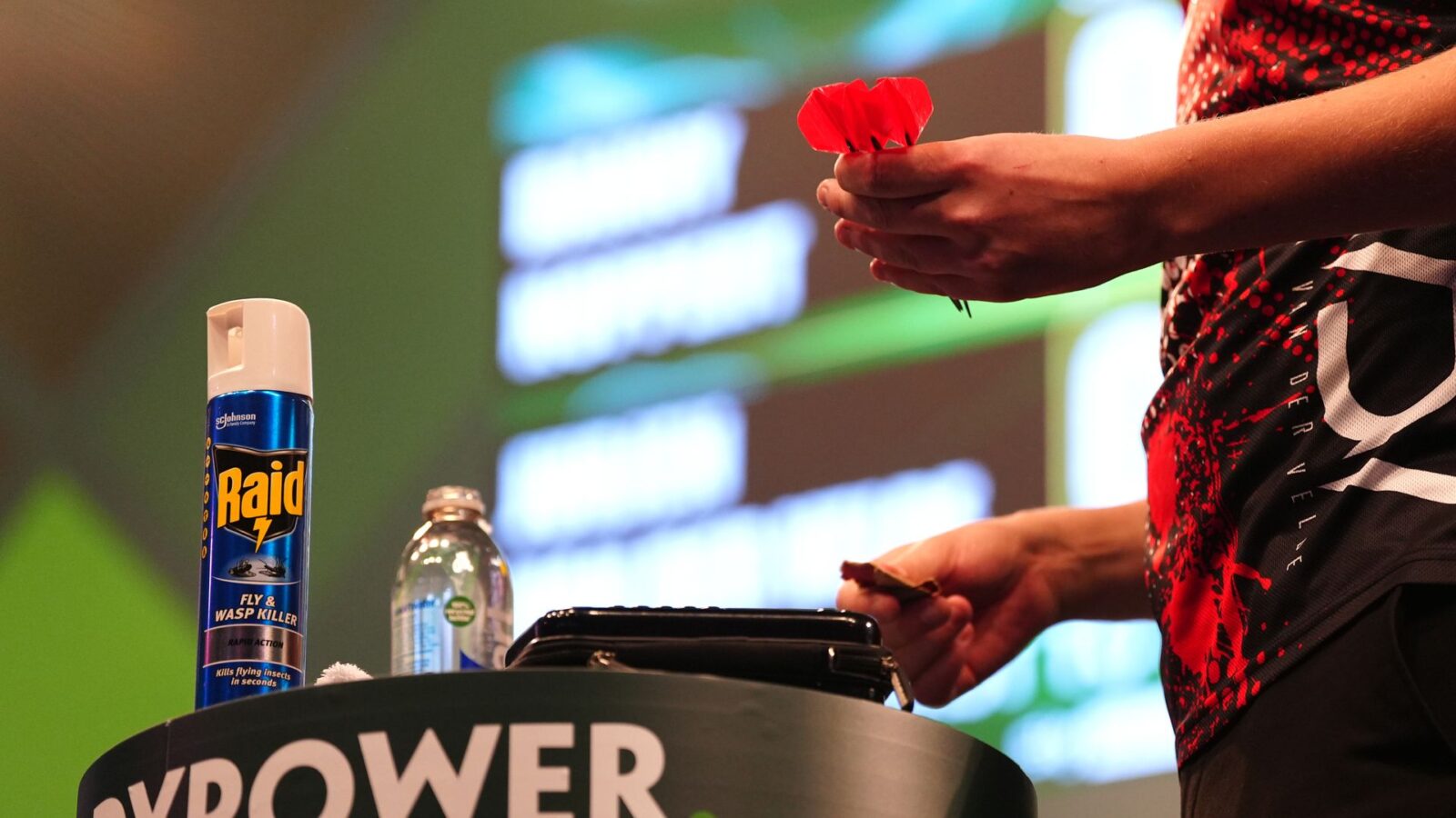 Alt text for the image: A photo of the Alexandra Palace wasp on the stage of the World Darts Championship.