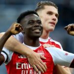 Arsenal players celebrating their win over Everton