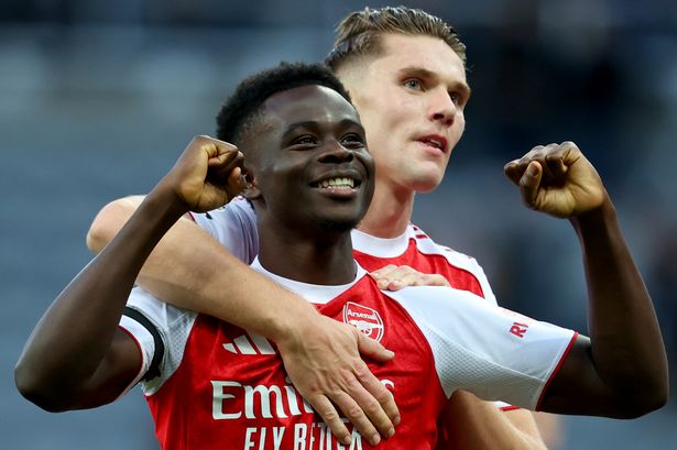Arsenal players celebrating their win over Everton