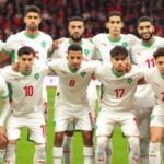 Les joueurs de l'équipe nationale marocaine de football célébrant un but lors de la CAN 2025 face à la Tanzanie.