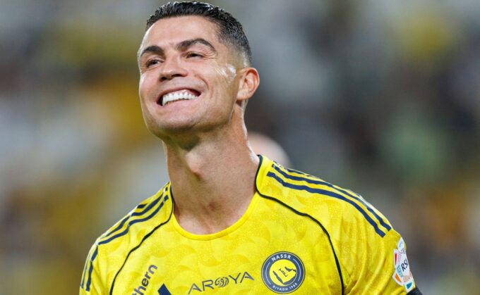 Cristiano Ronaldo smiling in a Saudi Pro League game.