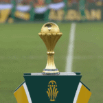 صورة لمكتب قضائي داخل ملعب، مع خلفية جماهيرية حيوية.