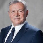 صورة للملك الأردن عبد الله الثاني مع لاعبي منتخب الأردن.