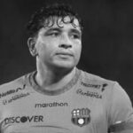 Football player lying on the ground with a gunshot wound.