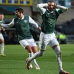 Hibs players celebrating a goal at Easter Road.
