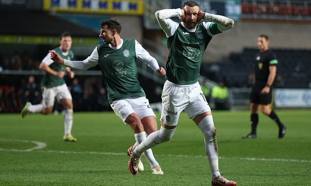 Hibs players celebrating a goal at Easter Road.