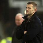 Luton Town players react to a goal at Reading.