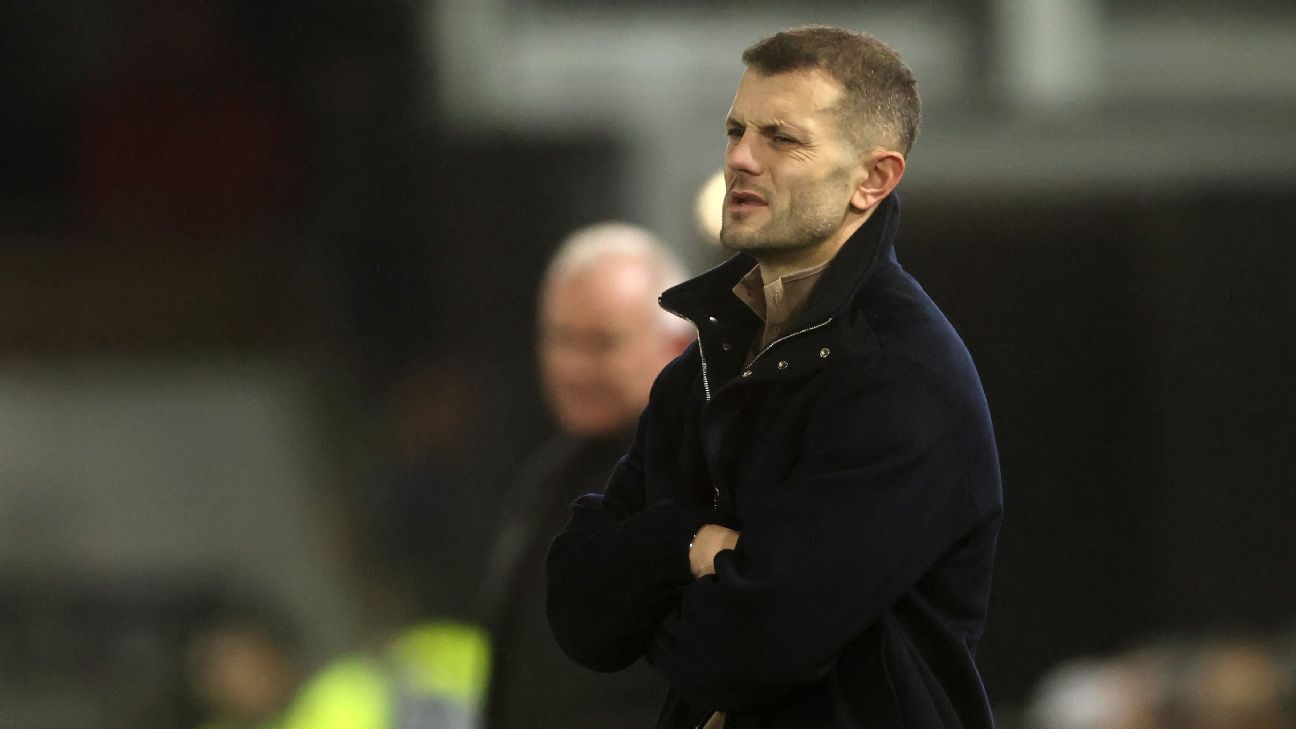 Luton Town players react to a goal at Reading.