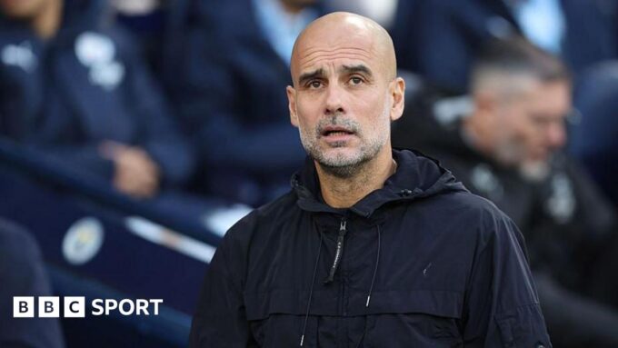 Manchester City players on the training pitch.