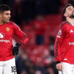 Manchester United player in action on the pitch.