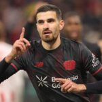 Martin Terrier celebrating his goal with a darts throw.