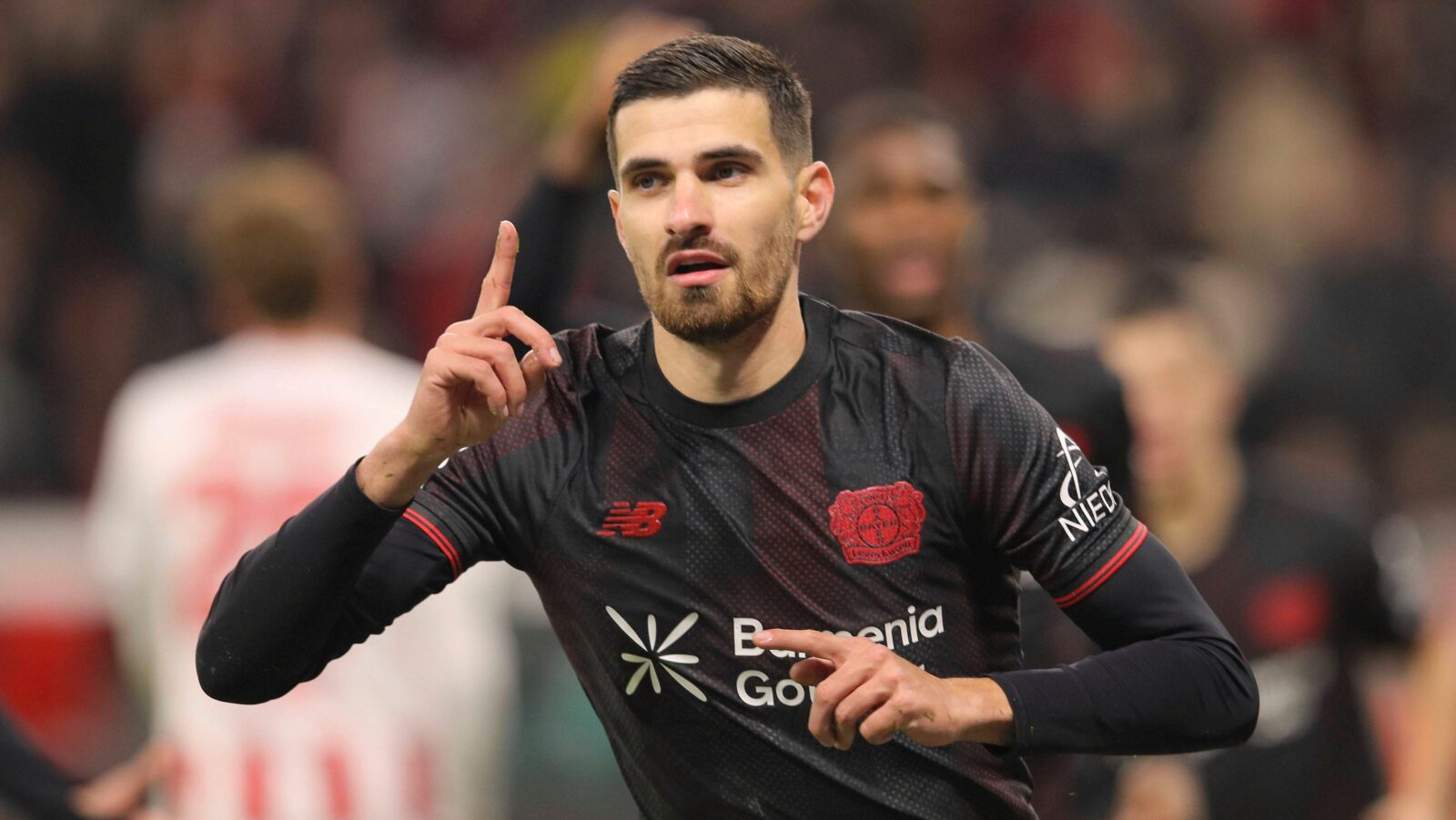 Martin Terrier celebrating his goal with a darts throw.