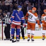 Matt Rempe in action during a Rangers game.