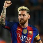 Lionel Messi celebrates scoring a goal during a UEFA Champions League game with Barcelona in 2016.