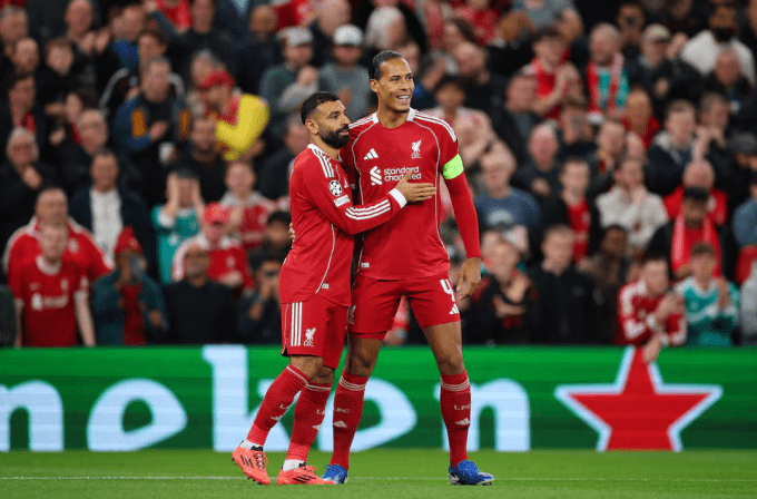 Virgil van Dijk and Mohamed Salah in action for Liverpool FC.