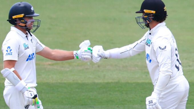 Tom Latham and Devon Conway bump fists during day four of the third Test match.