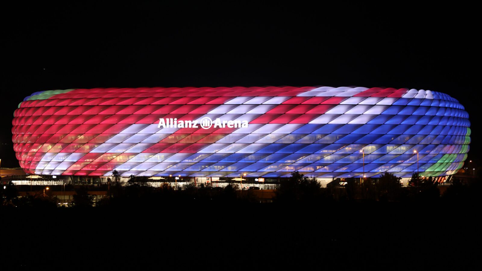 Alt text for the image: "Munich's Allianz Arena at sunset"
