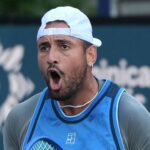 Nick Kyrgios in action on the tennis court.