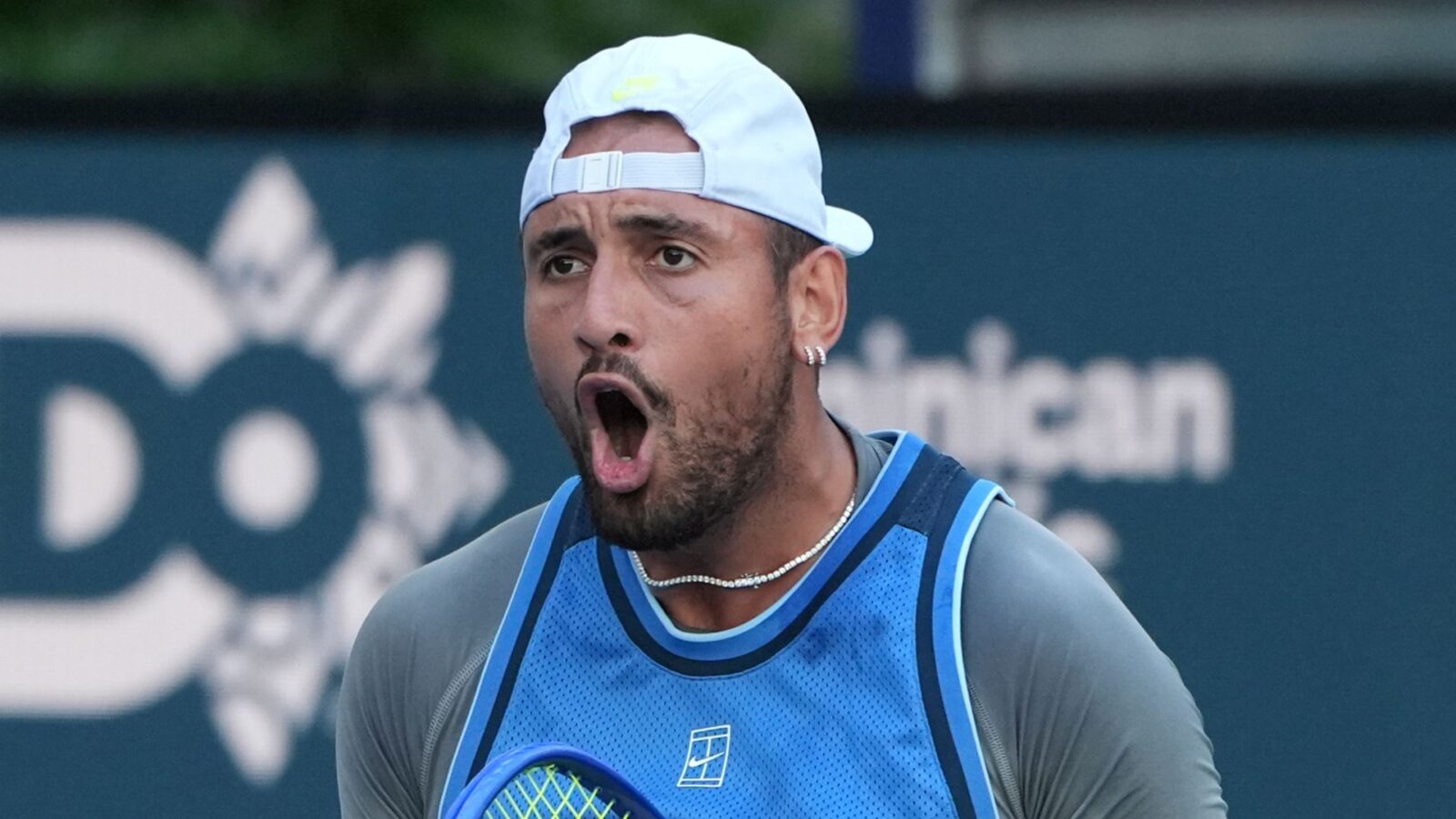 Nick Kyrgios in action on the tennis court.