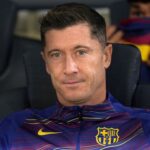 Robert Lewandowski of FC Barcelona looks on from the bench.