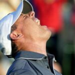 Rory McIlroy holding the Masters trophy.