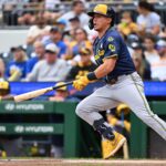 A photo of a baseball field with a trade graphic overlay.