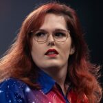 Noa-Lynn Van Leuven in action on the darts board.