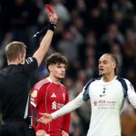 VAR officials reviewing footage on a screen