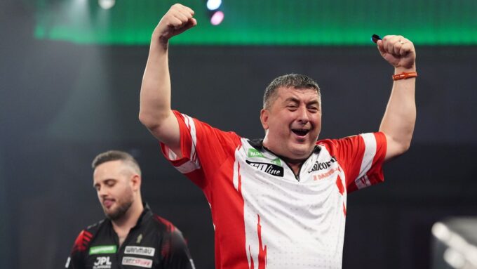 Mensur Suljovic in action during the World Darts Championship