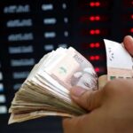 Graphique montrant la dépréciation de la paire USD/MAD et l'appréciation du dirham marocain.